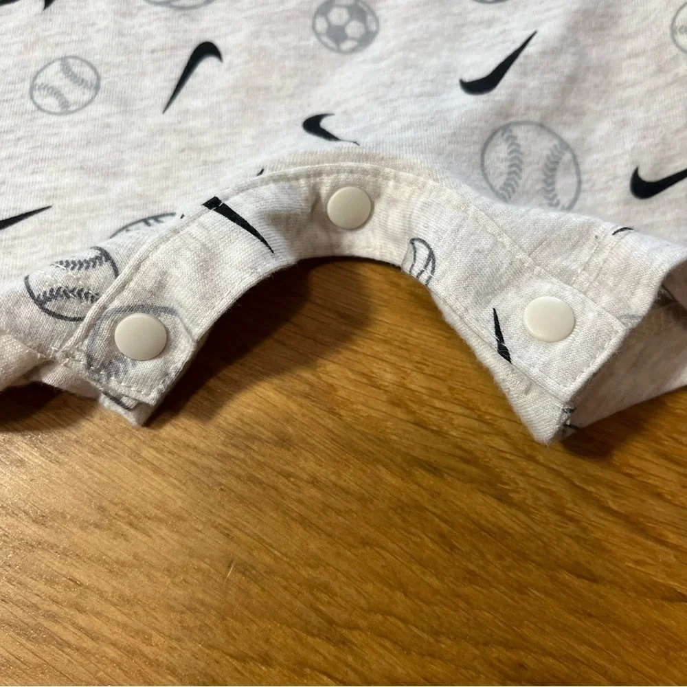 Nike Cream and Black Bodysuit with Short Sleeves and Sports Print